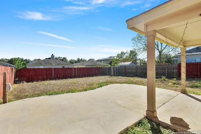 a view of backyard with green space