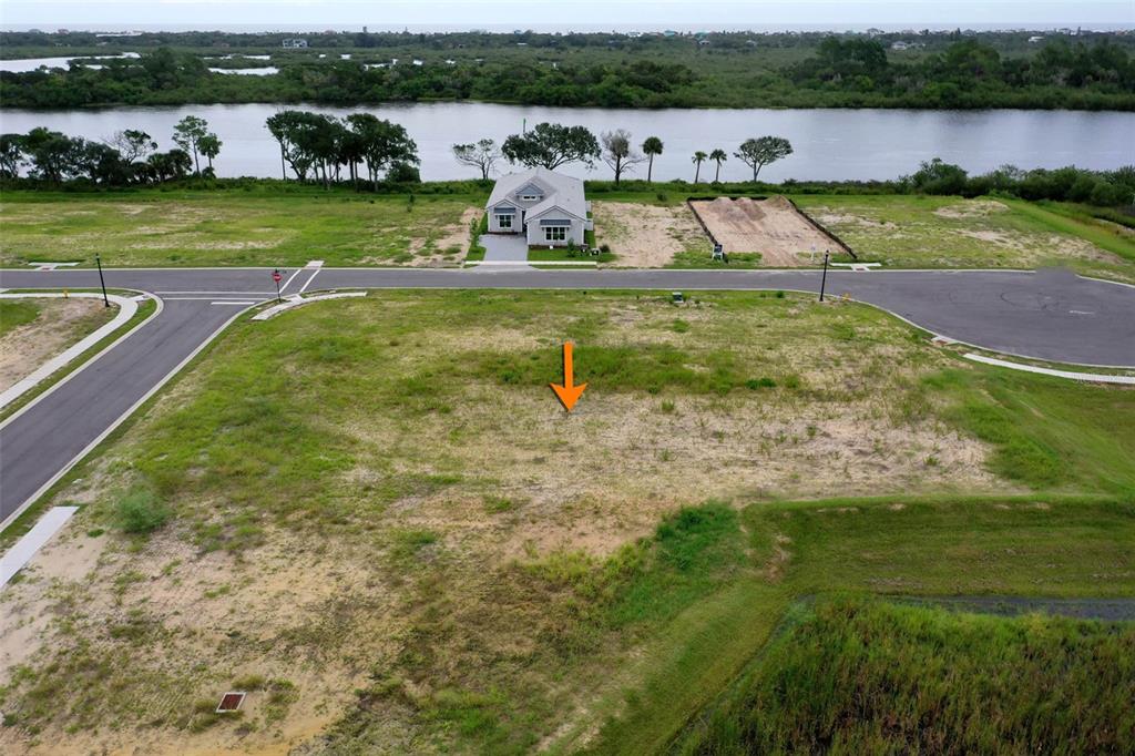 153 Coronado Road Flagler Beach, FL 32136 - Photo 4 of 19 a view of a garden with houses