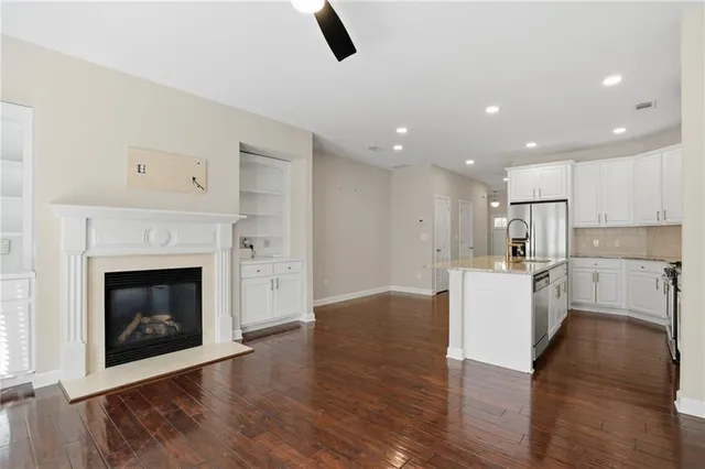 a view of kitchen with furniture and wooden floor