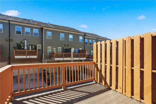 a view of a brick house with a large window