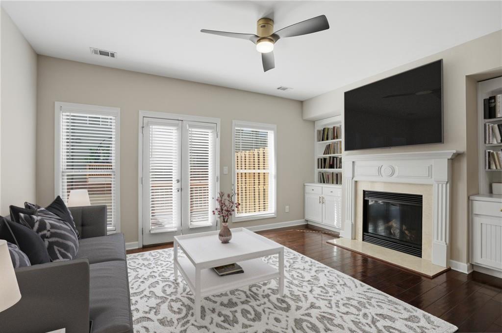 1221 Lavista Road Northeast Atlanta, GA 30324 - Photo 14 of 31 a living room with furniture a flat screen tv and a fireplace