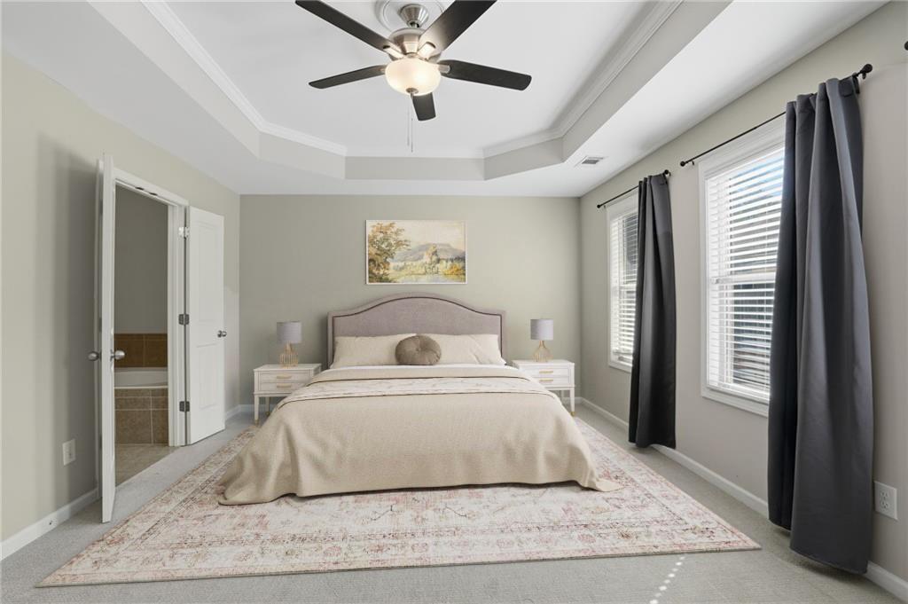 1221 Lavista Road Northeast Atlanta, GA 30324 - Photo 20 of 31 a bedroom with a large bed and a chandelier