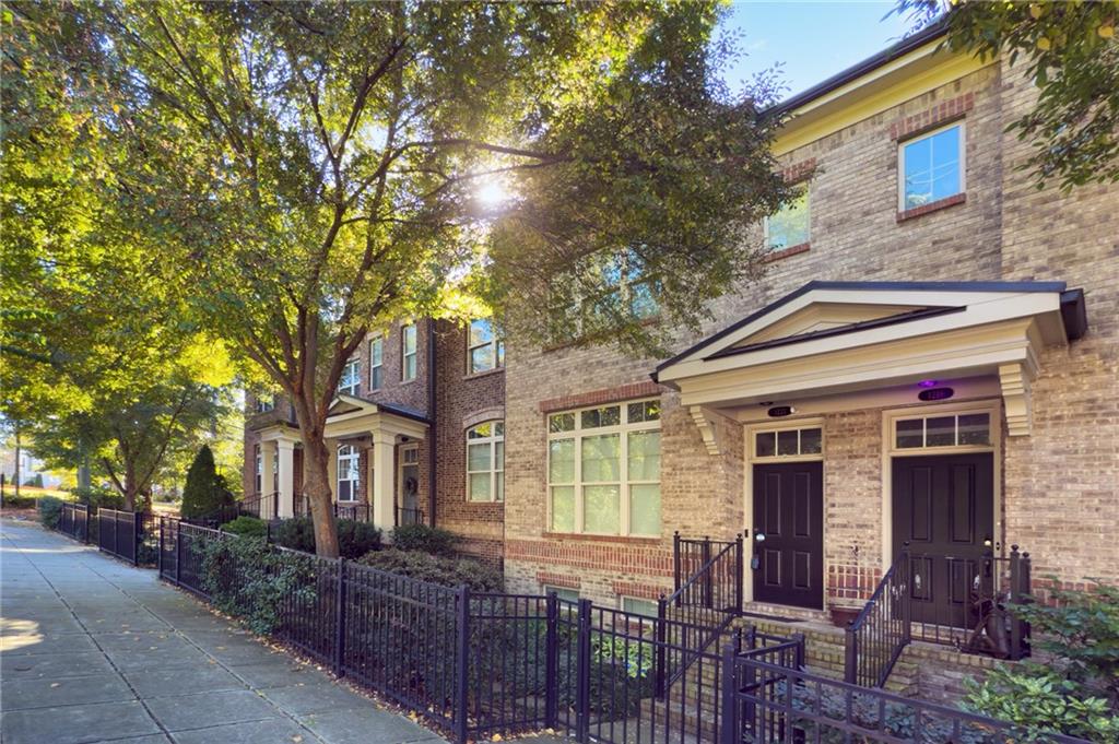 1221 Lavista Road Northeast Atlanta, GA 30324 - Photo 2 of 31 a front view of a house with large trees