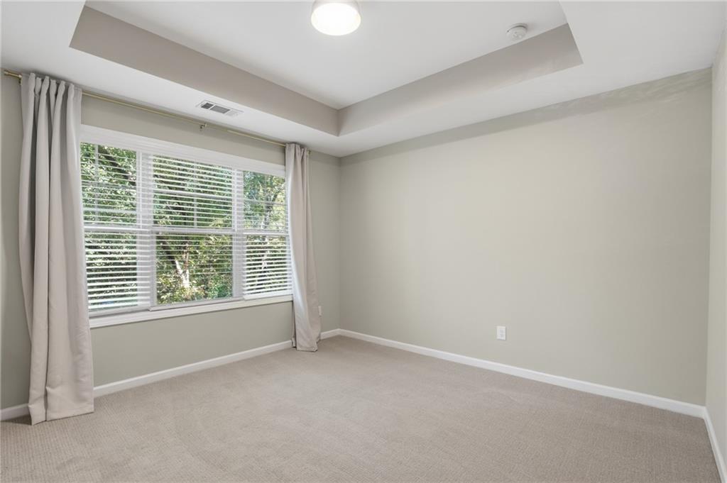 1221 Lavista Road Northeast Atlanta, GA 30324 - Photo 26 of 31 an empty room with a window