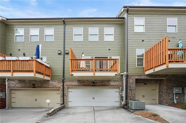 a front view of a house with garage