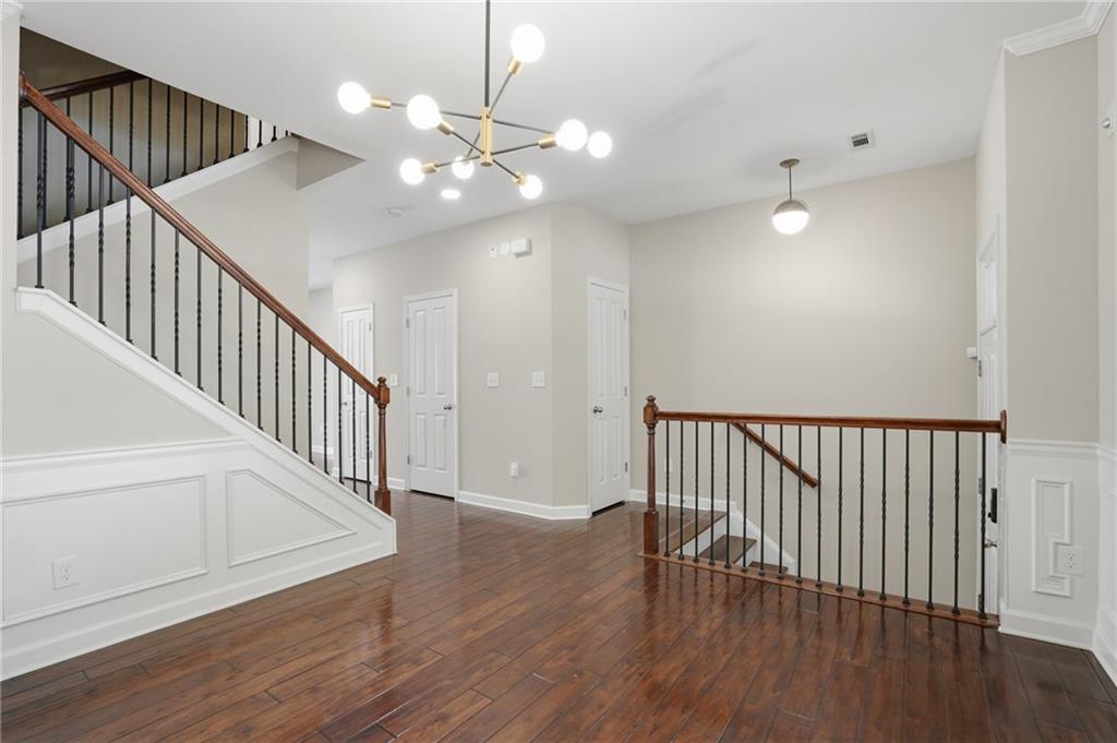 1221 Lavista Road Northeast Atlanta, GA 30324 - Photo 6 of 31 a view of staircase with wooden floor and fan