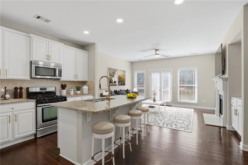 1221 Lavista Road Northeast Atlanta, GA 30324 - Photo 7 of 31 a open kitchen with sink cabinets and wooden floor