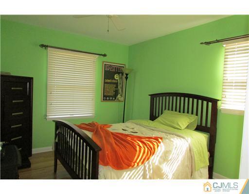 60 Club House Road Brick, NJ 08723 - Photo 13 of 23 a bedroom with a bed and a window
