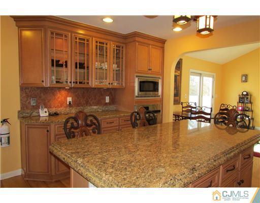60 Club House Road Brick, NJ 08723 - Photo 14 of 23 a kitchen with sink refrigerator and stove