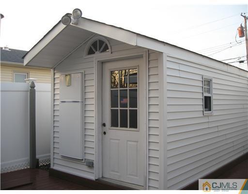60 Club House Road Brick, NJ 08723 - Photo 20 of 23 a front view of a house