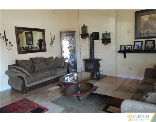 60 Club House Road Brick, NJ 08723 - Photo 3 of 23 a living room with furniture and a flat screen tv