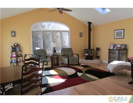 60 Club House Road Brick, NJ 08723 - Photo 6 of 23 a living room with furniture and a fireplace