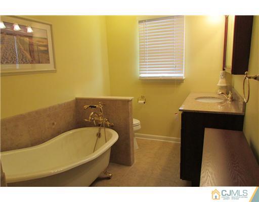 60 Club House Road Brick, NJ 08723 - Photo 8 of 23 a bathroom with a sink and a bathtub