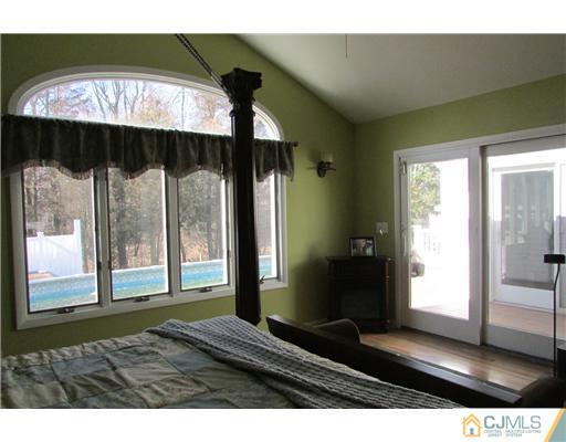 60 Club House Road Brick, NJ 08723 - Photo 10 of 23 a bedroom with a bed and a large window