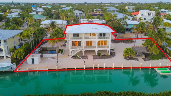 a view of swimming pool with outdoor seating