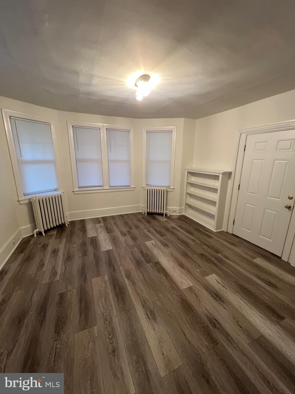 31 West Central Avenue, Unit 1 Paoli, PA 19301 - Photo 6 of 7 a view of empty room with wooden floor