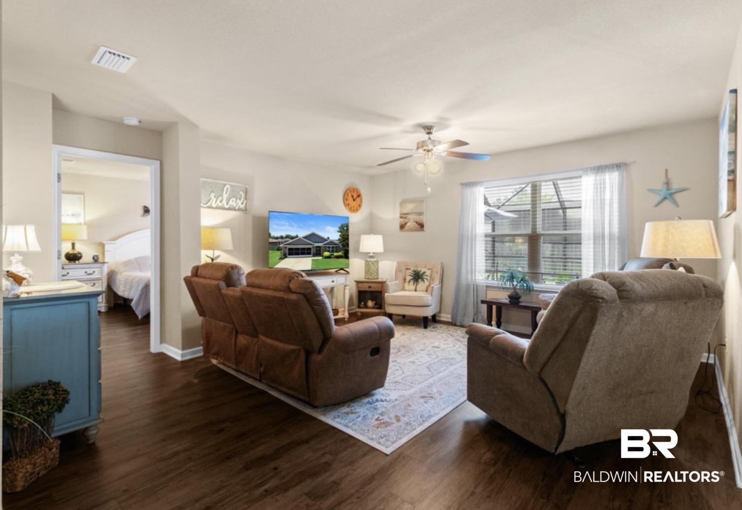 1676 Abbey Loop Foley, AL 36535 - Photo 5 of 31 Living area featuring dark wood-finish flooring, light-colored walls, and a ceiling fan