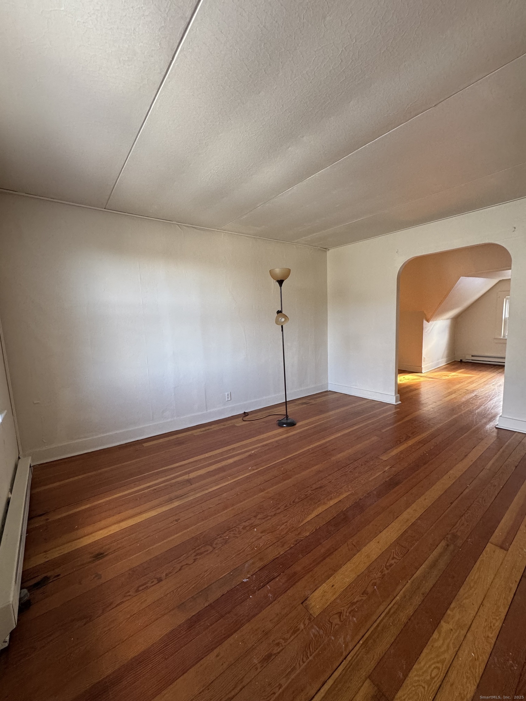 144 Montauk Avenue, Unit 3 New London, CT 06320 - Photo 2 of 8 a view of empty room with wooden floor