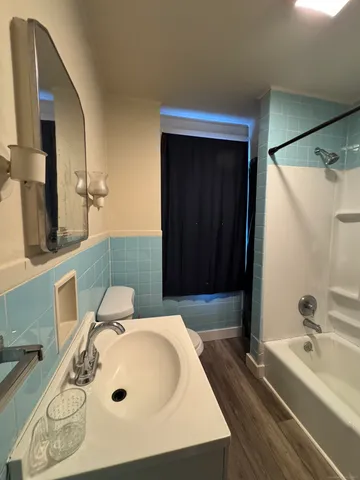 a bathroom with a bathtub and a sink