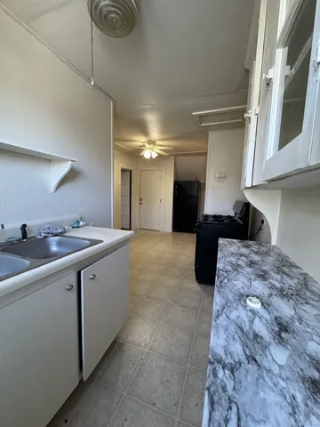 a large bathroom with a sink and a mirror