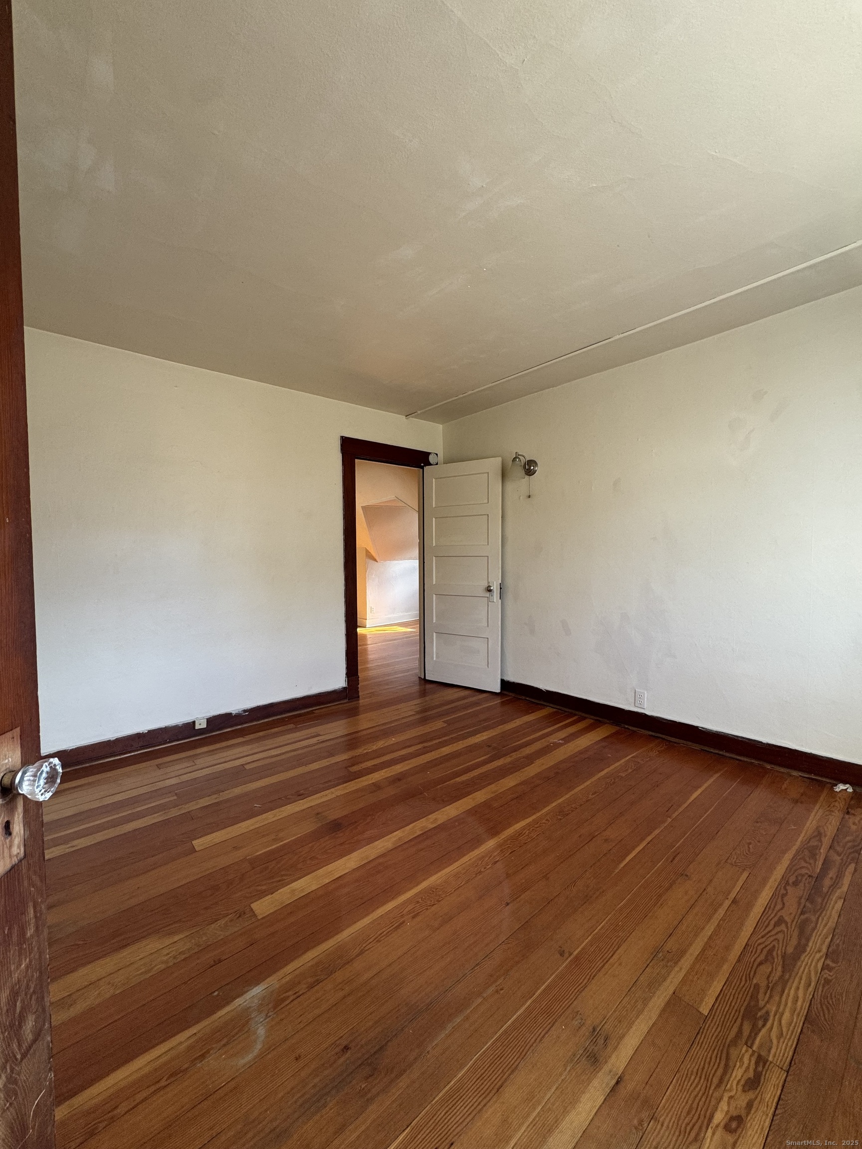 144 Montauk Avenue, Unit 3 New London, CT 06320 - Photo 8 of 8 a view of an empty room and wooden floor