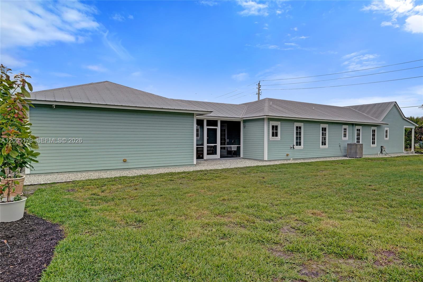 4648 Southeast Binnacle Way Stuart, FL 34997 - Photo 60 of 80 Extra lot view to side of house