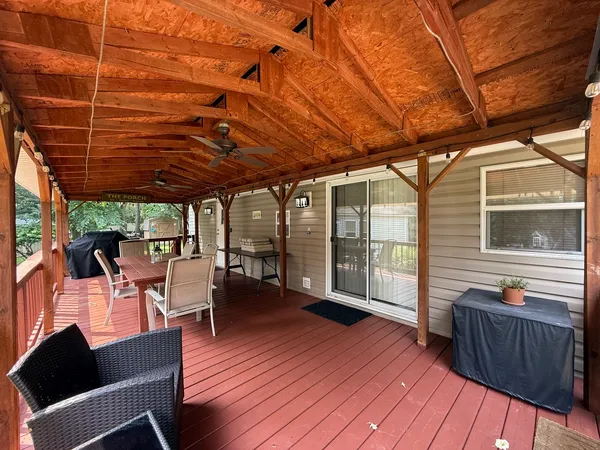 a view of a patio with table and chairs