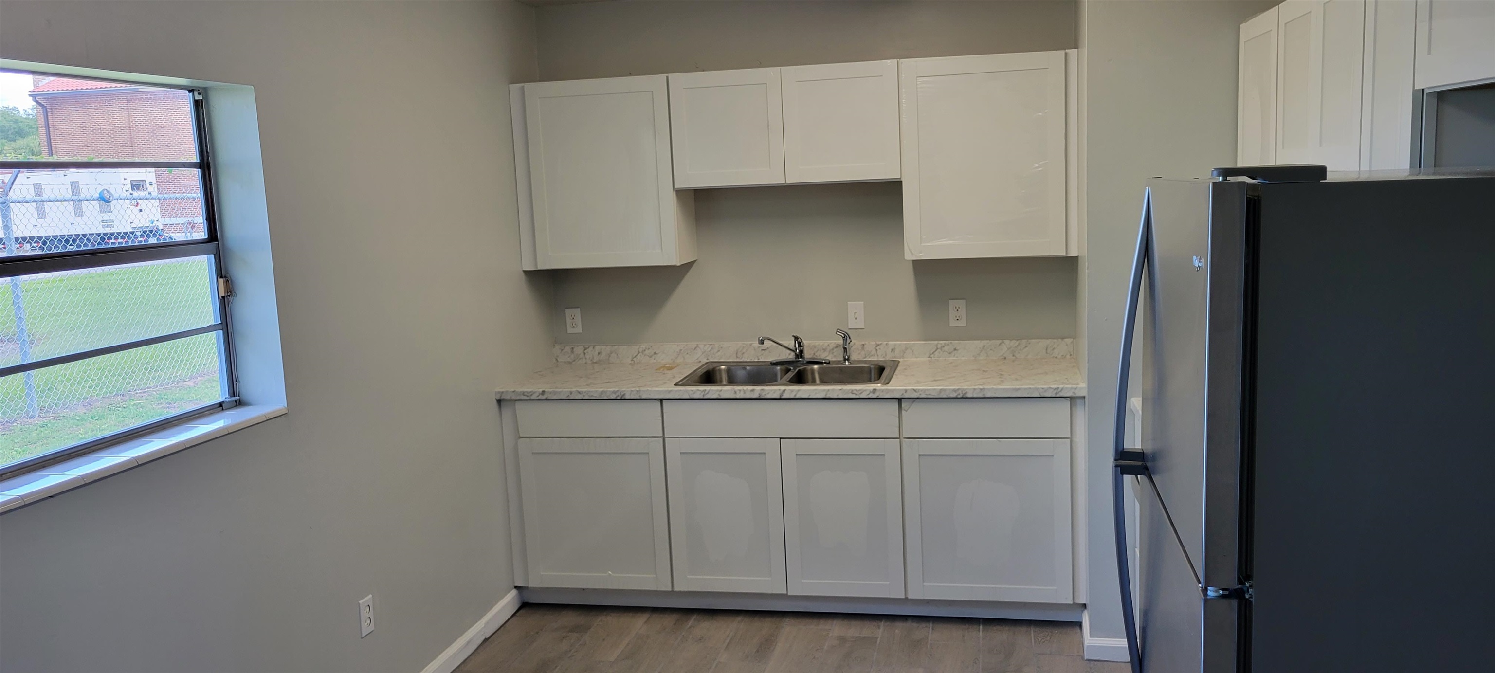 3 Travis Lane St. Augustine, FL 32084 - Photo 17 of 22 a kitchen with stainless steel appliances a sink and cabinets
