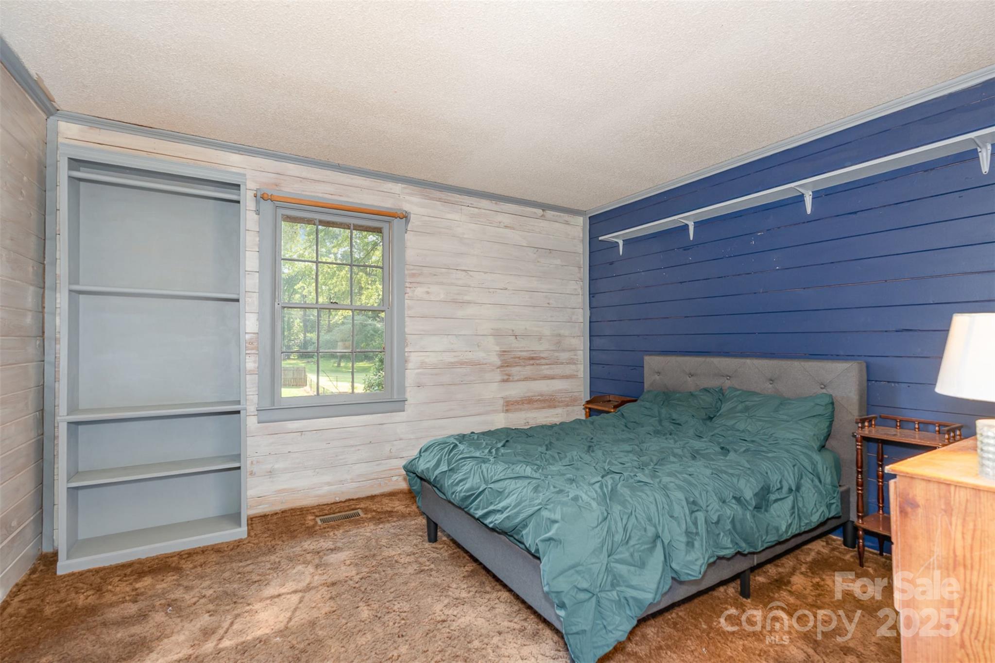 417 Phifer Road Kings Mountain, NC 28086 - Photo 19 of 31 a bed sitting in a bedroom next to a window