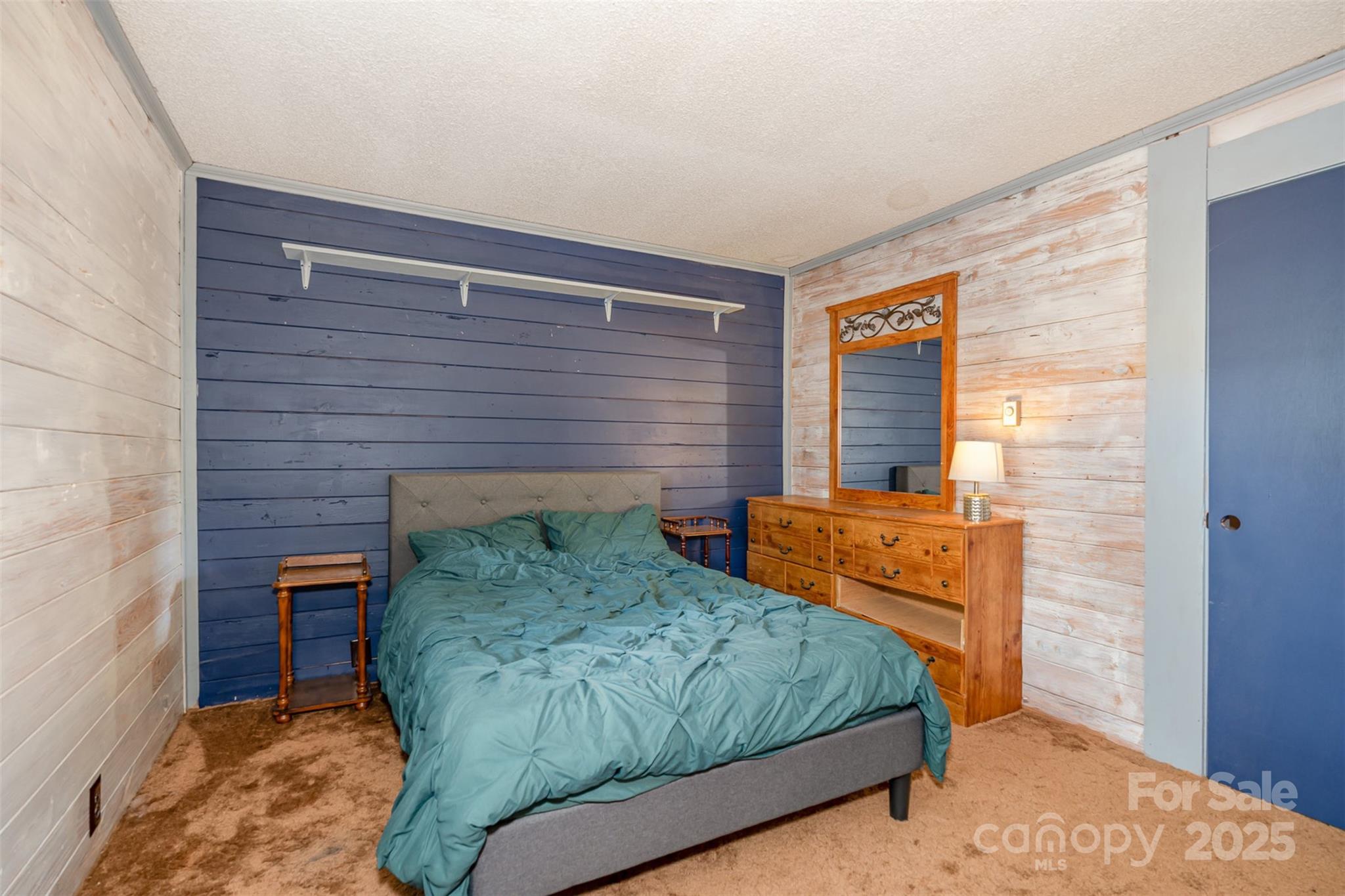417 Phifer Road Kings Mountain, NC 28086 - Photo 20 of 31 a bedroom with a bed and a brick wall