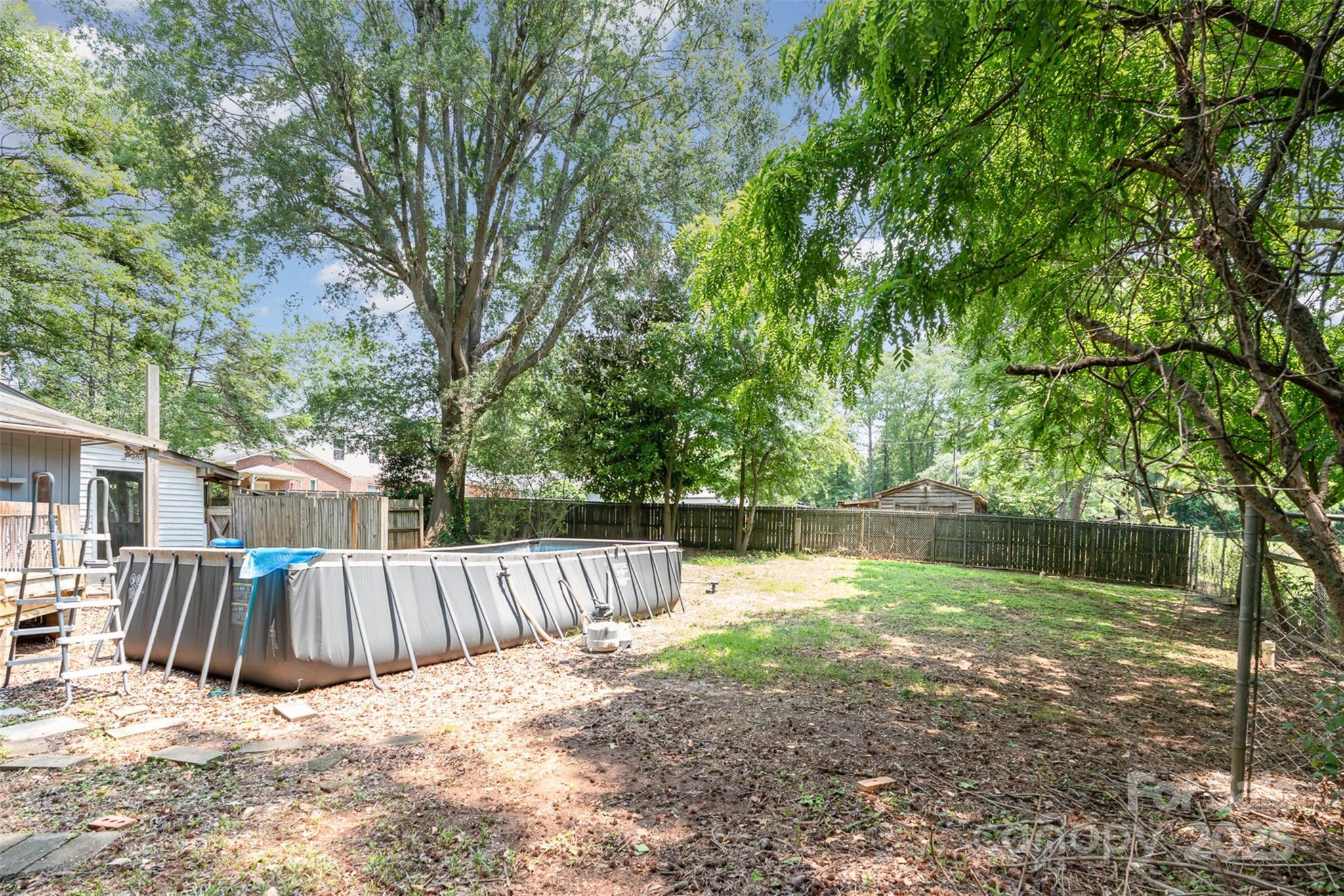 417 Phifer Road Kings Mountain, NC 28086 - Photo 29 of 31 a view of backyard with tree and wooden fence