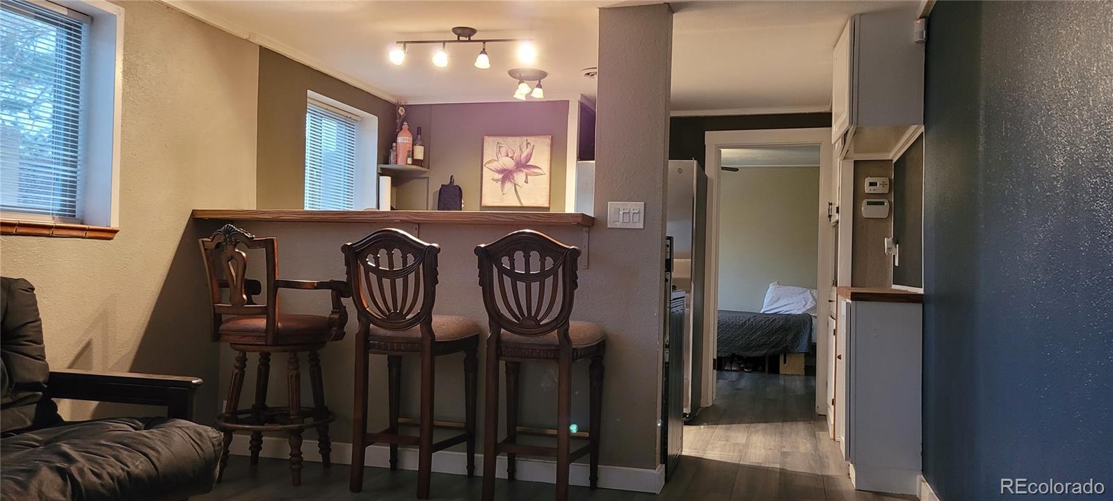 4737 Lowell Boulevard Denver, CO 80211 - Photo 22 of 28 a view of a entryway door and living room