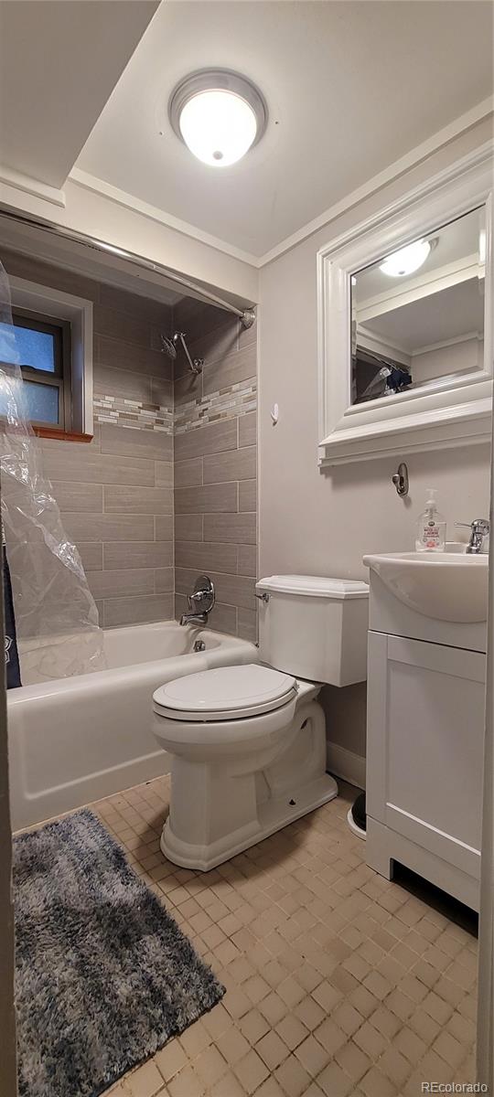4737 Lowell Boulevard Denver, CO 80211 - Photo 25 of 28 a bathroom with a sink a toilet and bathtub