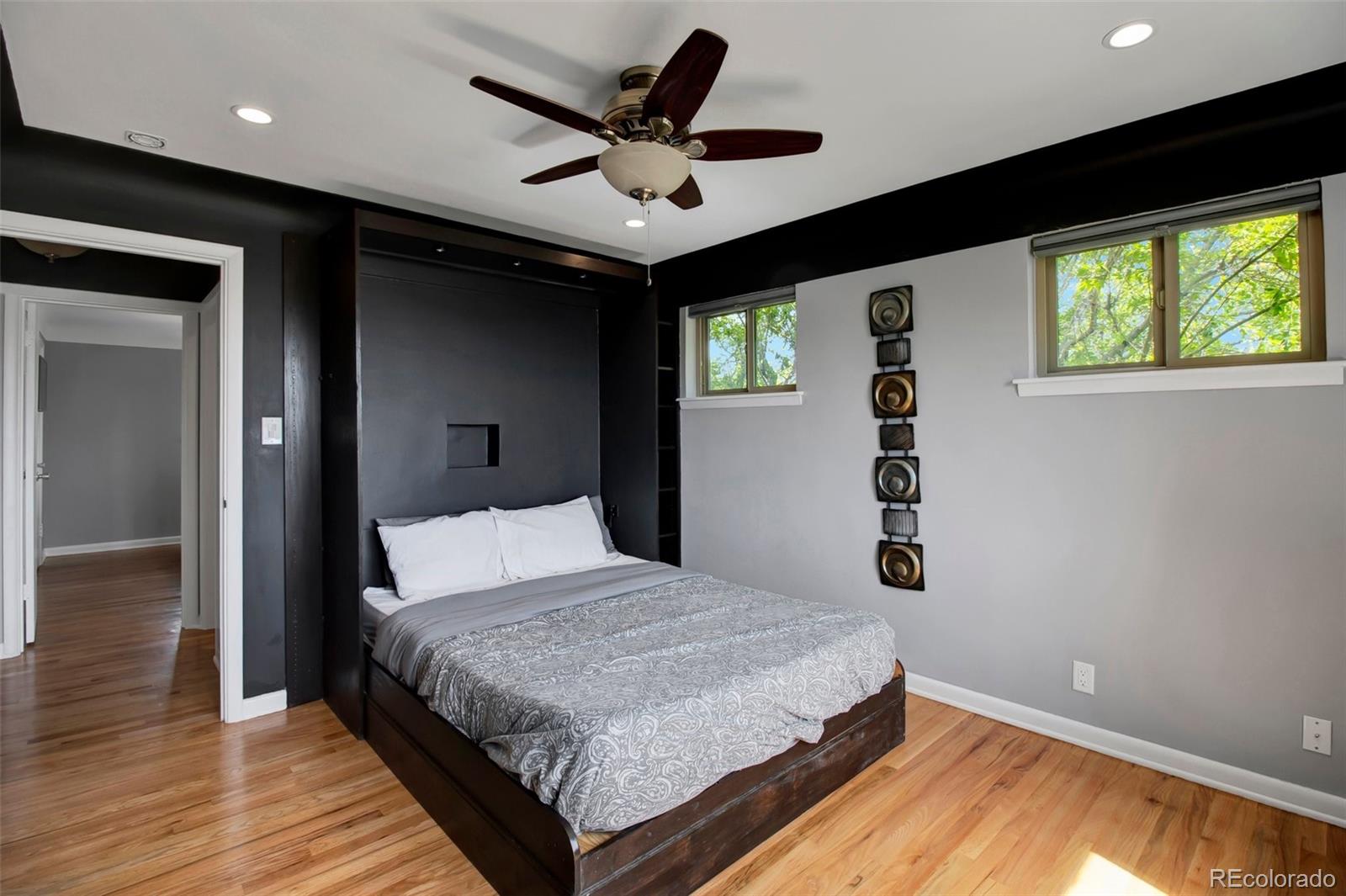 4737 Lowell Boulevard Denver, CO 80211 - Photo 10 of 28 a bedroom with a bed and a window