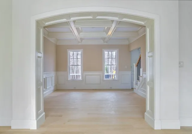 a view of a very nice looking dining room with a table and chairs