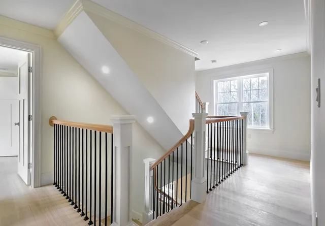 a bathroom with a double vanity sink a toilet and a tub
