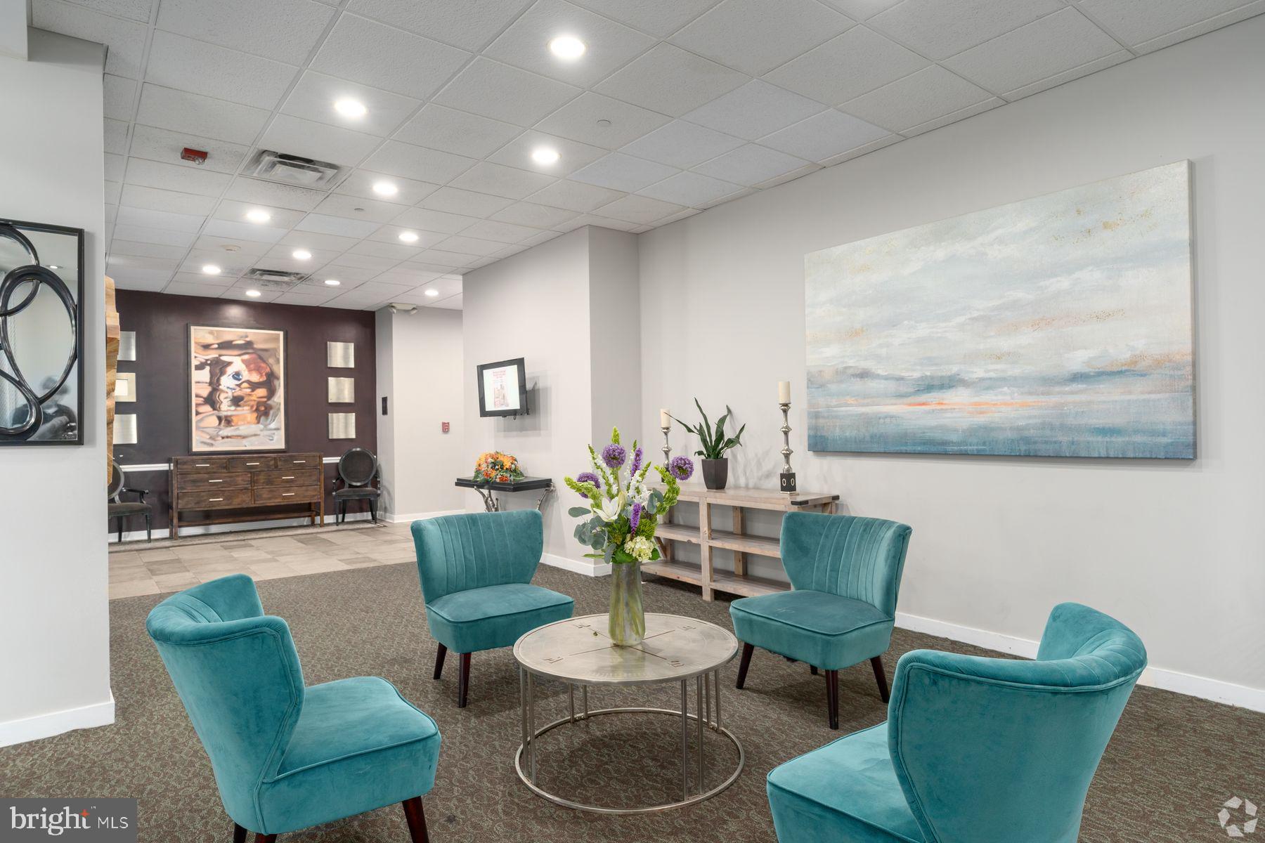 8440 Limekiln Pike, Unit STUDIO Wyncote, PA 19095 - Photo 6 of 11 a living room with furniture and a wooden floor