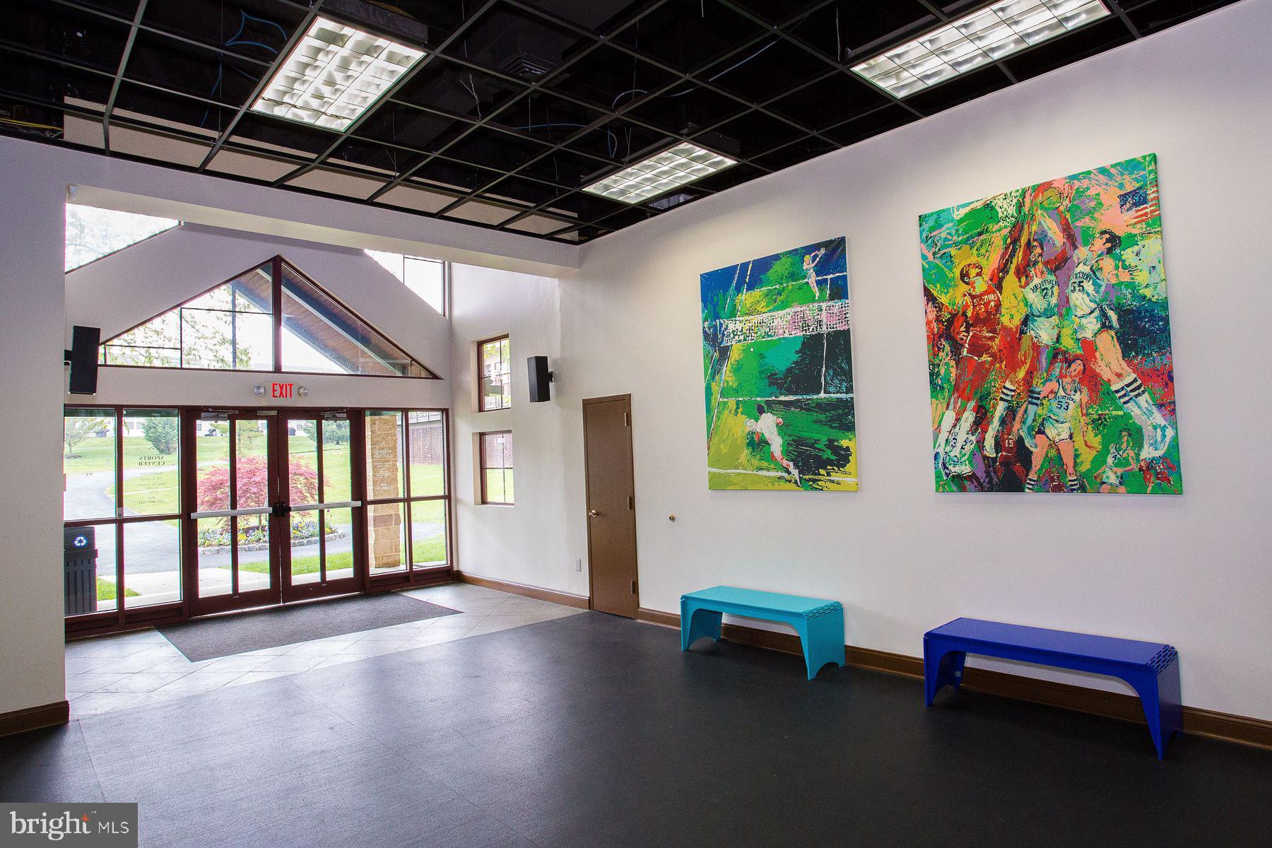 8440 Limekiln Pike, Unit STUDIO Wyncote, PA 19095 - Photo 8 of 11 a dining room with furniture a floor to ceiling window and a table