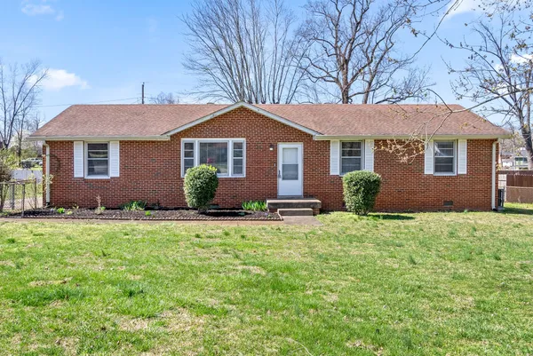 front view of a house with a yard
