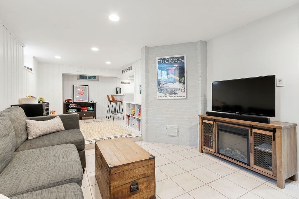 62 Grant Street Needham, MA 02492 - Photo 17 of 24 a living room with furniture and a flat screen tv