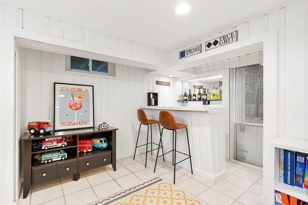 62 Grant Street Needham, MA 02492 - Photo 19 of 24 a kitchen with stainless steel appliances kitchen island granite countertop a refrigerator and a stove top oven