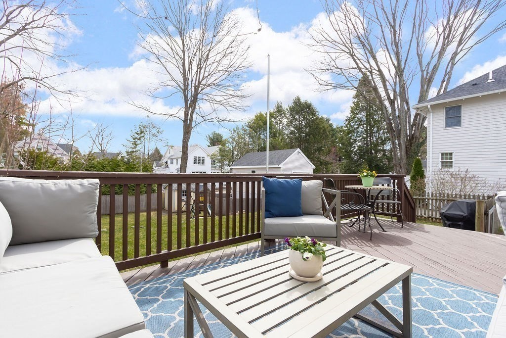 62 Grant Street Needham, MA 02492 - Photo 20 of 24 a view of a patio with a table and chairs