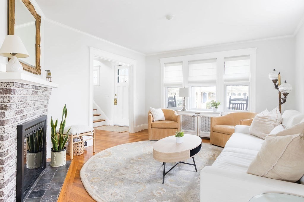 62 Grant Street Needham, MA 02492 - Photo 2 of 24 a living room with furniture fireplace and a large window
