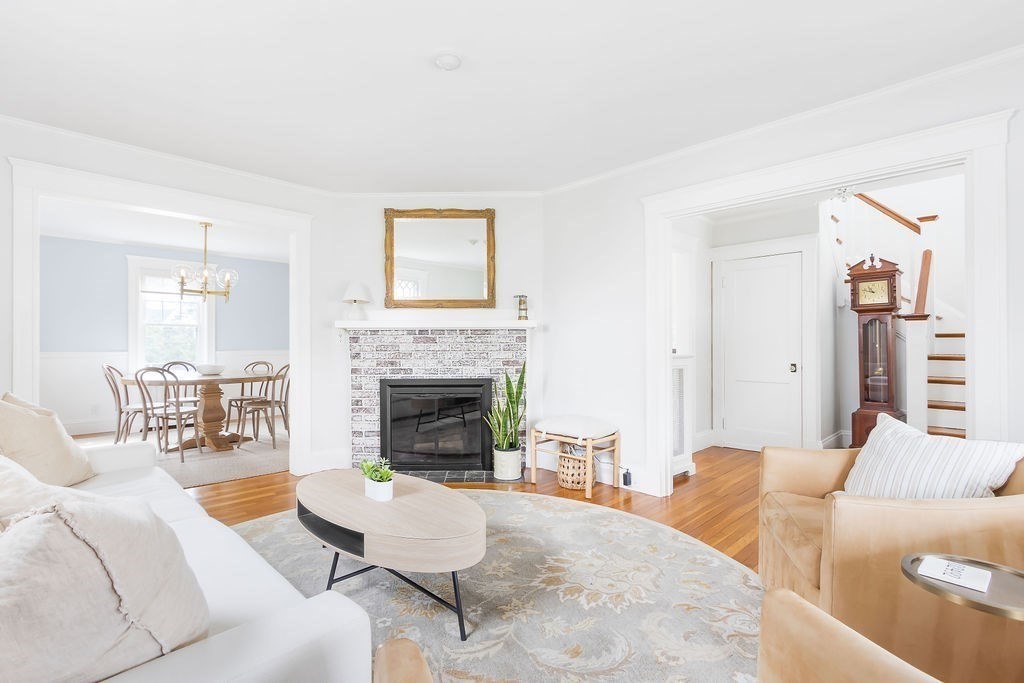 62 Grant Street Needham, MA 02492 - Photo 3 of 24 a living room with furniture and a fireplace