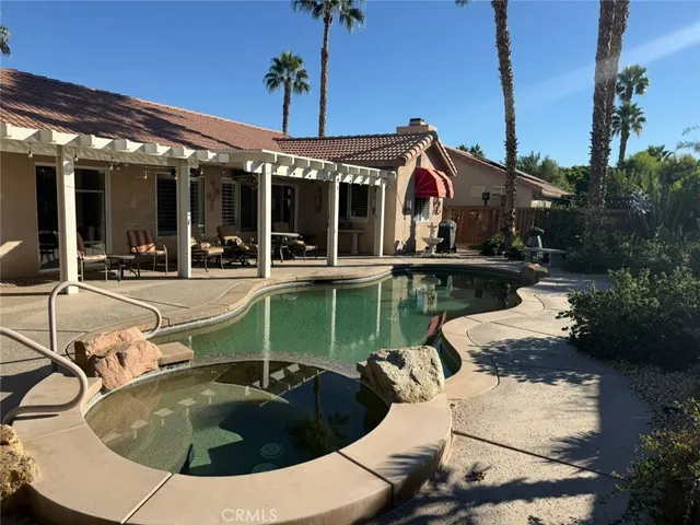 a view of a house with swimming pool