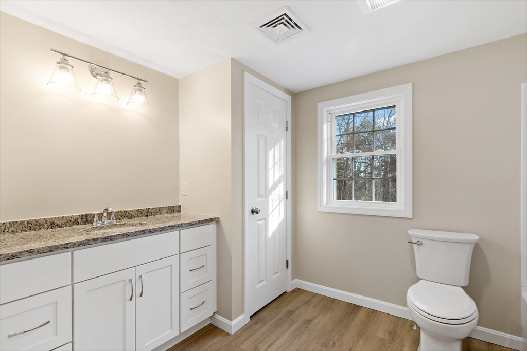 2 Womponoag Road Plymouth, MA 02360 - Photo 19 of 24 a spacious bathroom with a granite countertop sink toilet and shower