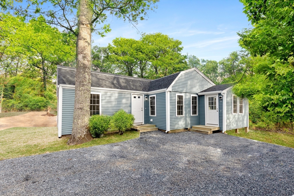 2 Womponoag Road Plymouth, MA 02360 - Photo 22 of 24 a front view of a house with garden