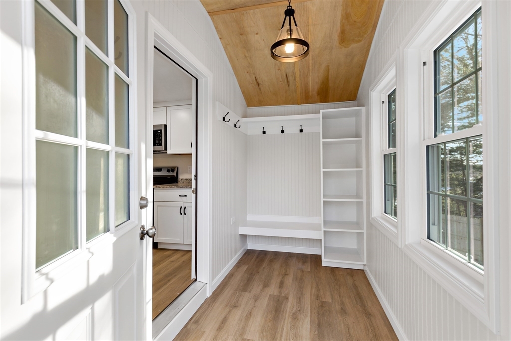 2 Womponoag Road Plymouth, MA 02360 - Photo 4 of 24 a view of walk in closet with wooden floor and windows