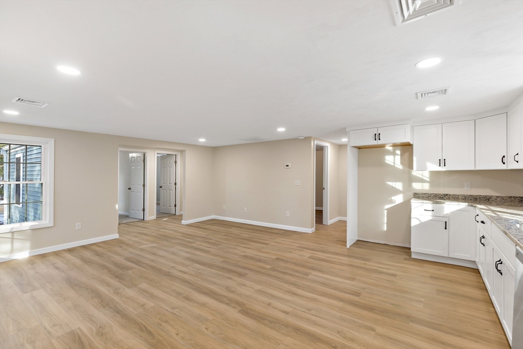 2 Womponoag Road Plymouth, MA 02360 - Photo 6 of 24 a view of an empty room with window and wooden floor