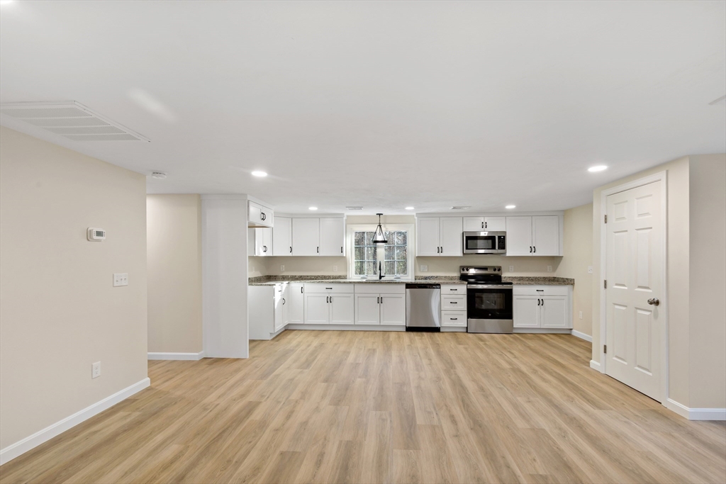 2 Womponoag Road Plymouth, MA 02360 - Photo 7 of 24 a large kitchen with a center island and stainless steel appliances